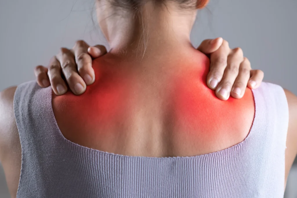 Woman's painful backpain relief Chiropractor in Holland, MI
