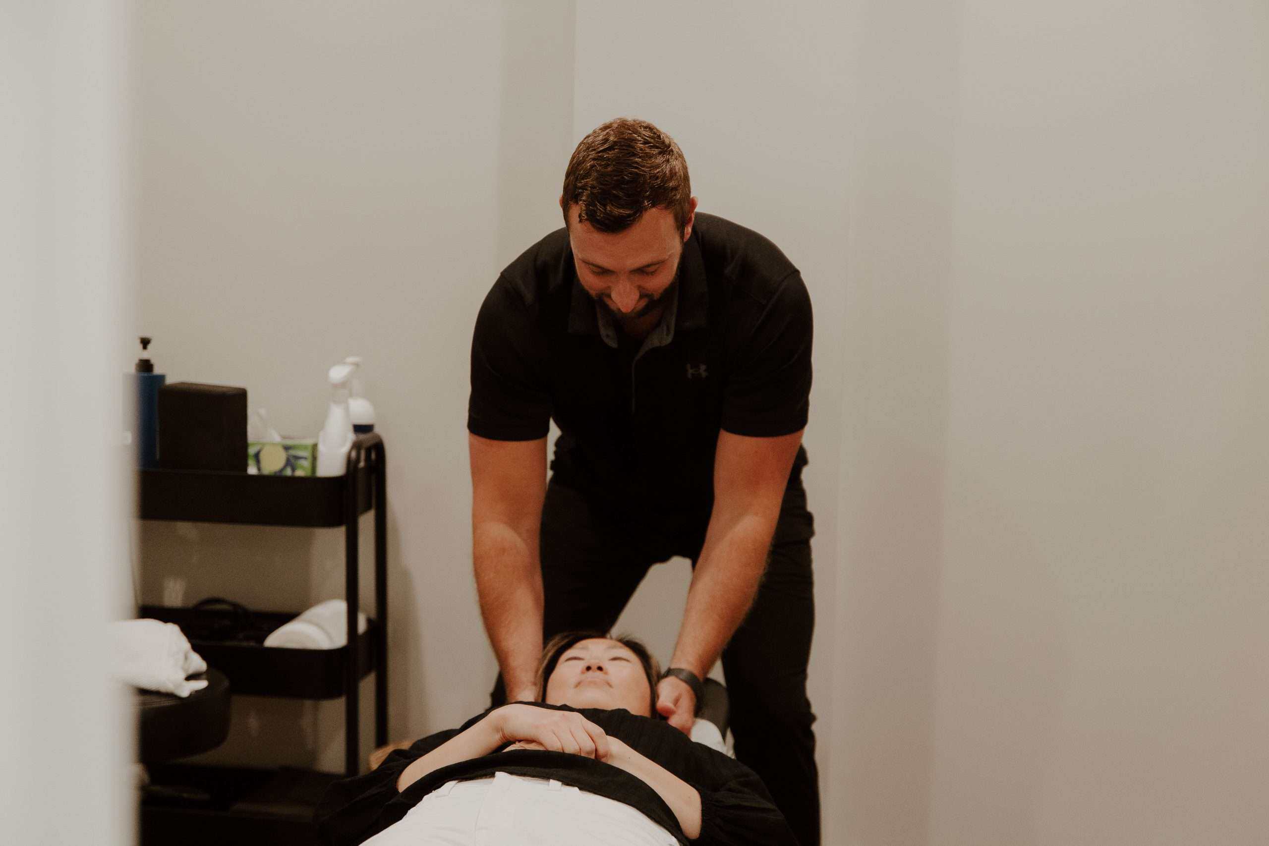 Chiropractor performing a cervical adjustment at McAlpine Chiropractic in Holland, MI
