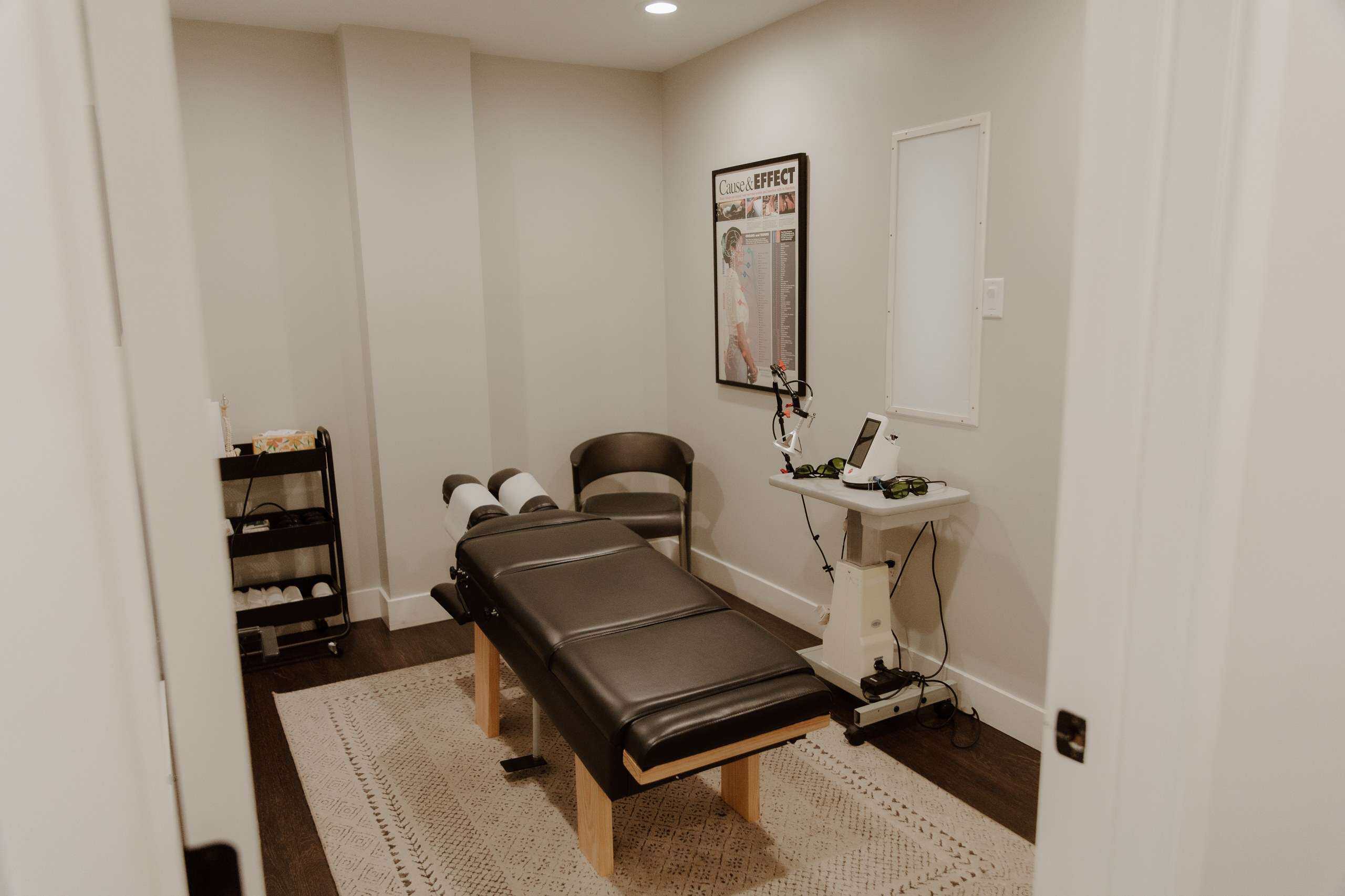 Chiropractic adjustment and Class IV laser therapy room at McAlpine Chiropractic, Holland MI